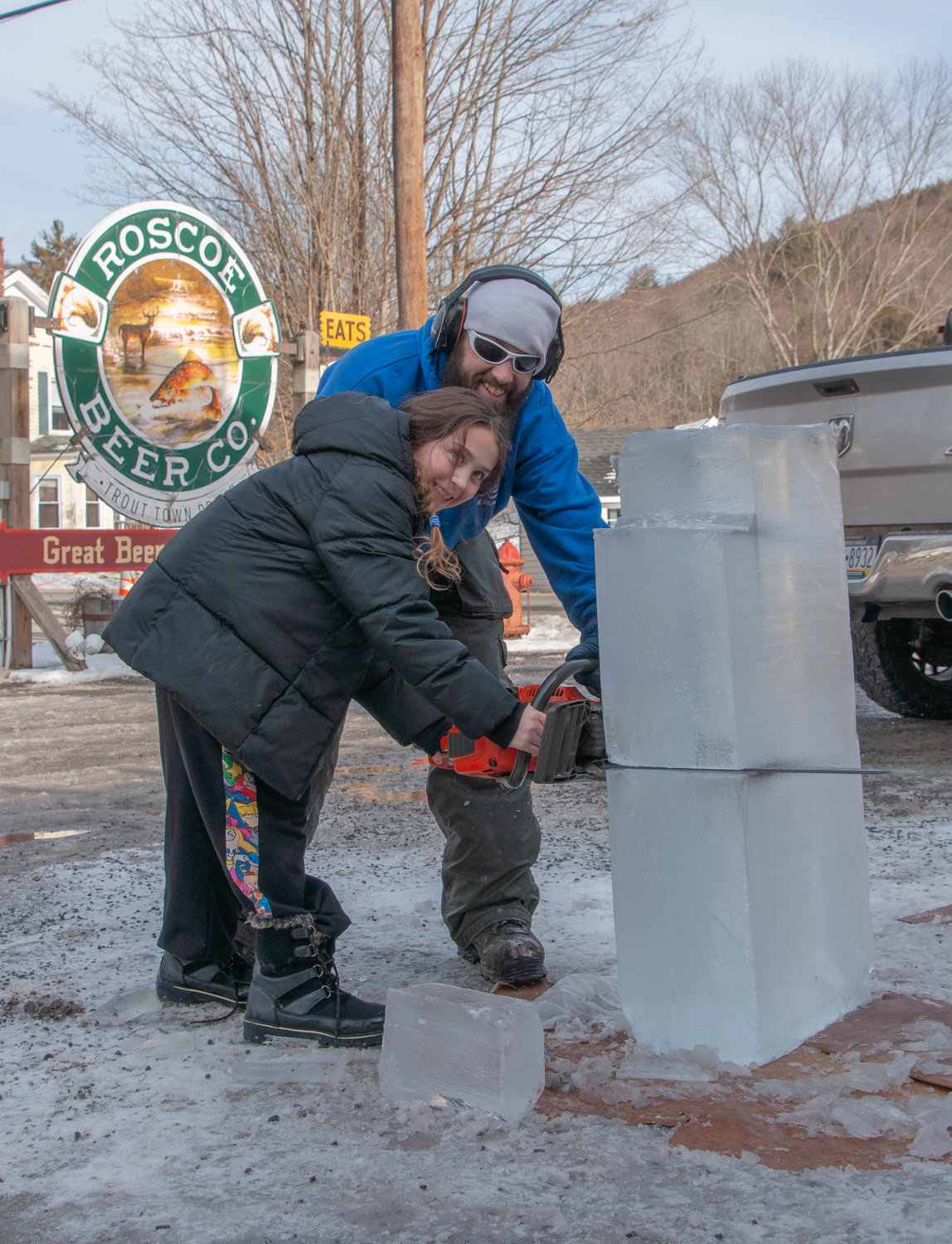 Stump Devil Jake Polick was teaching nine-year-old daughter Jocelyn the tricks of the trade during the 2023 Roscoe Beer WinterFest ice carving demo last weekend.
